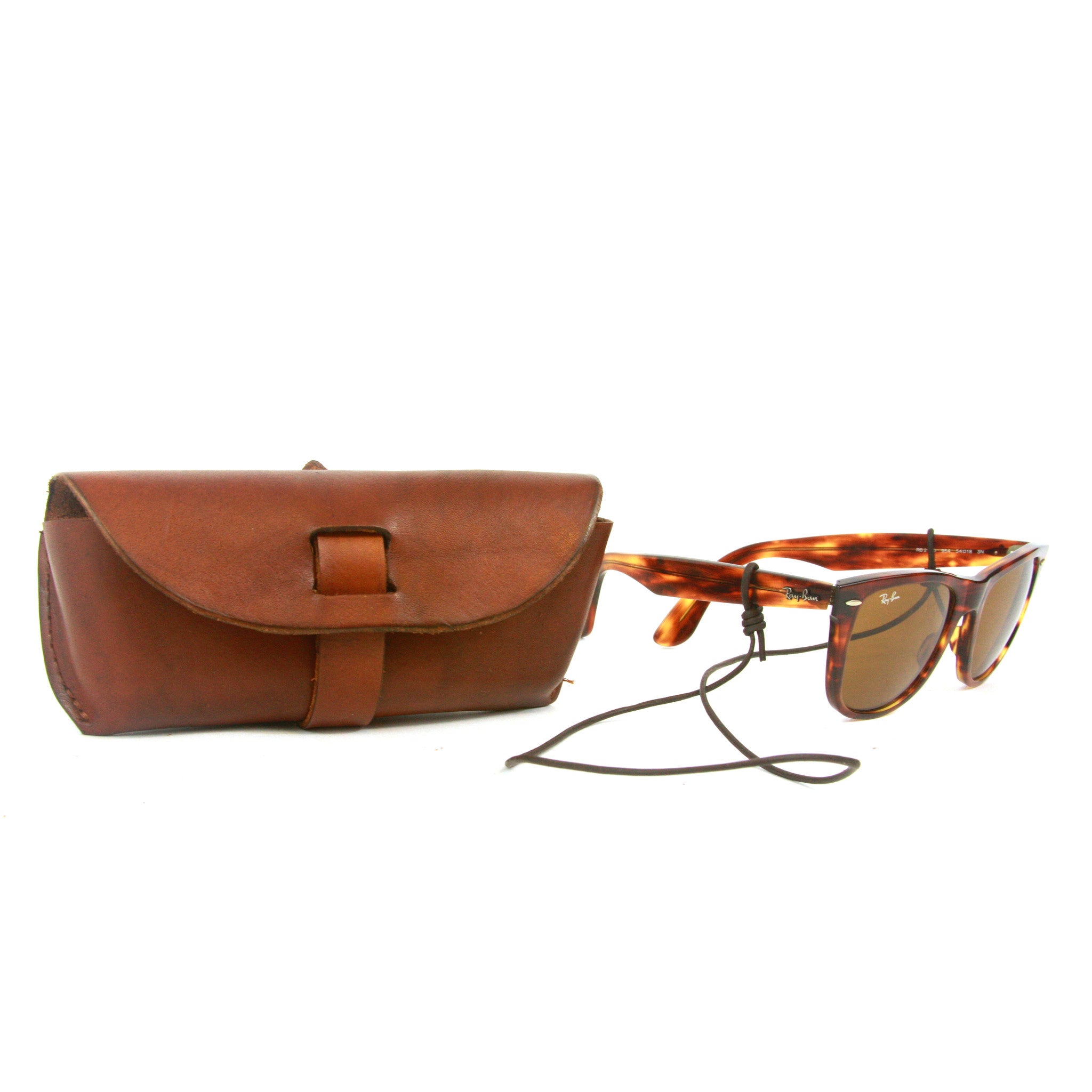 Glasses case, leather glasses case, sun glasses case, croakie, handmade leather case, leather case to keep your glasses protected and secure, featuring a multi-functional leather croakie for hanging either the case or your glasses around your neck.