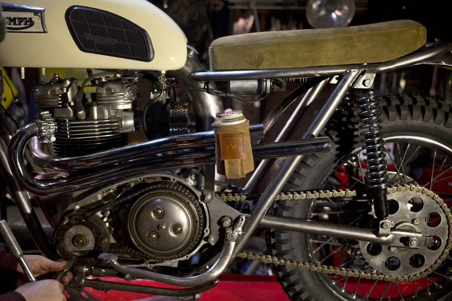 Magnetic Koozie, waxed canvas koozie, leather koozie, rare earth magnets, beer koozie, tallboy koozie, red clouds koozie, This is not your normal koozie. It uses very strong, rare earth magnets to hold the weight of your full beverage attached to the fridge, stove, your car or any other metal surface while you are working or playing. A clever back loop also lets you attach a string and wear the koozie around your neck.